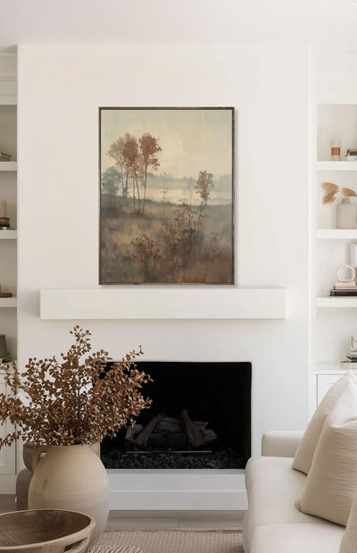 Living room with a fireplace, framed artwork, and decorative items.