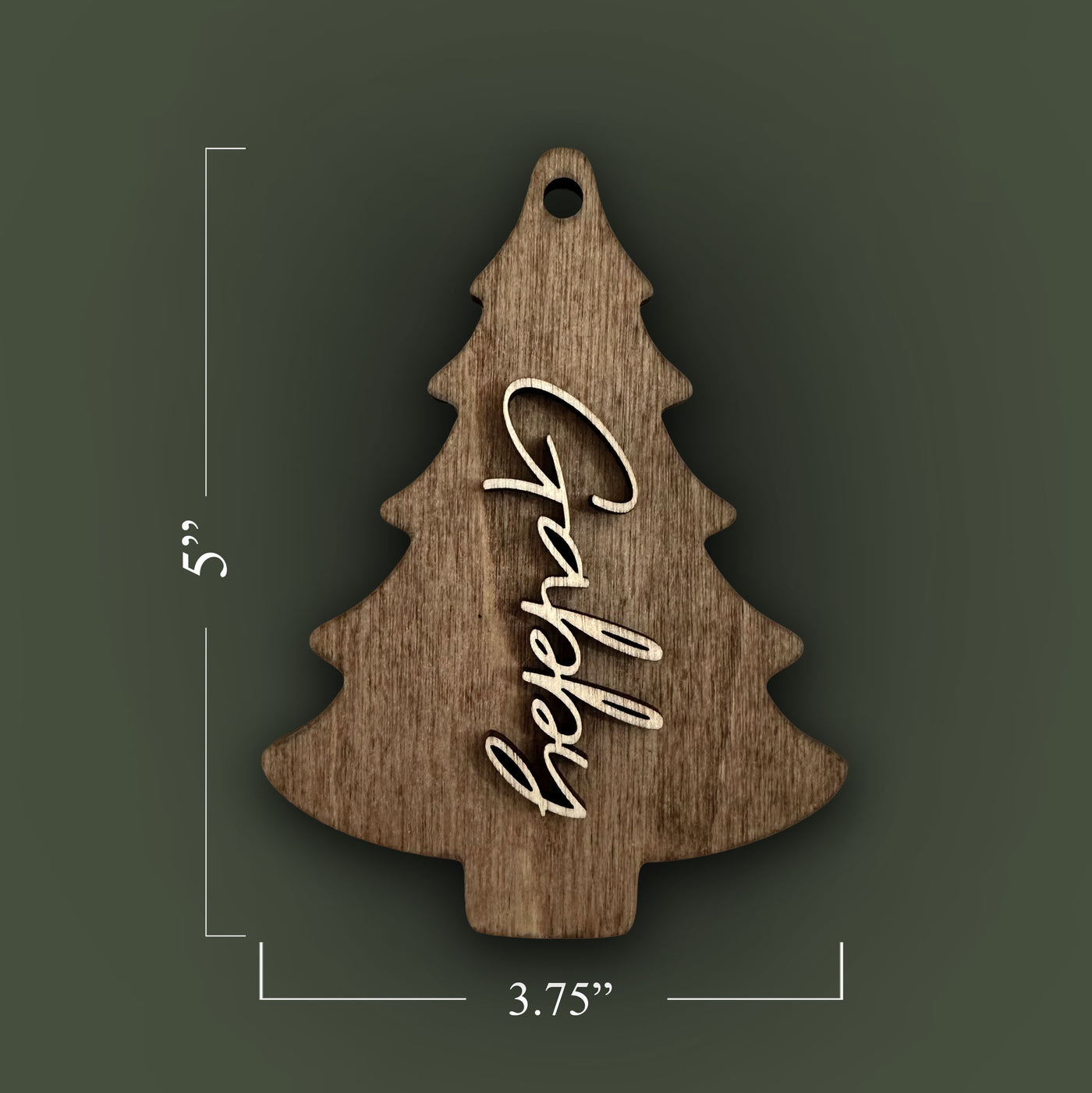 Wooden Christmas tree ornament with 'Happy' engraving and measurements on a special walnut stained background