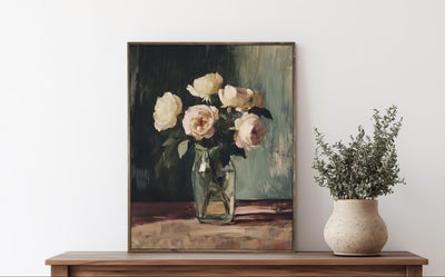Framed painting of flowers on a wooden dresser with a vase of plants.
