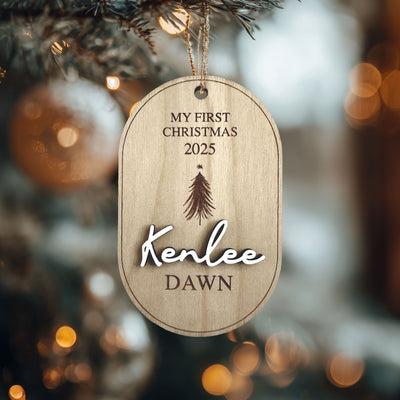 "Personalized My First Christmas wood ornament with custom baby name and year 2025, hanging on a Christmas tree."