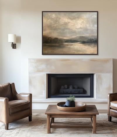 Living room with fireplace, leather chairs, and a landscape painting.