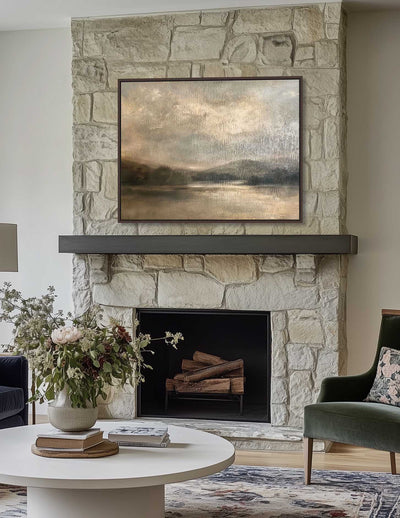 Living room with stone fireplace, artwork, and furniture.