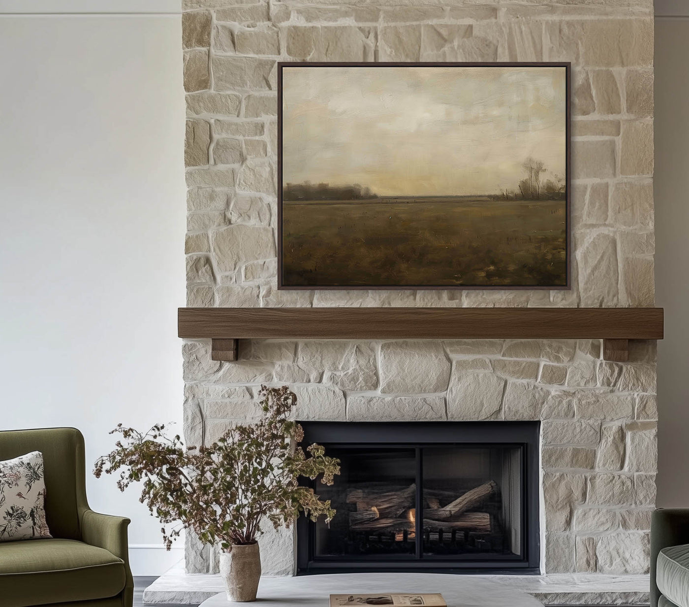 Living room with stone fireplace, painting, and green sofa