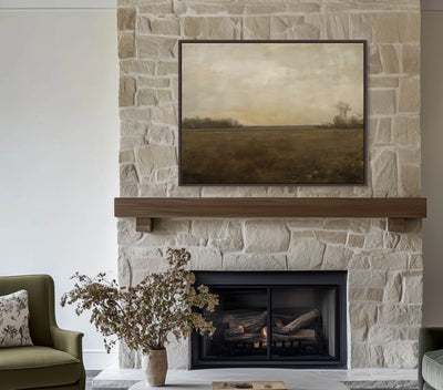 Living room with stone fireplace, painting, and green sofa
