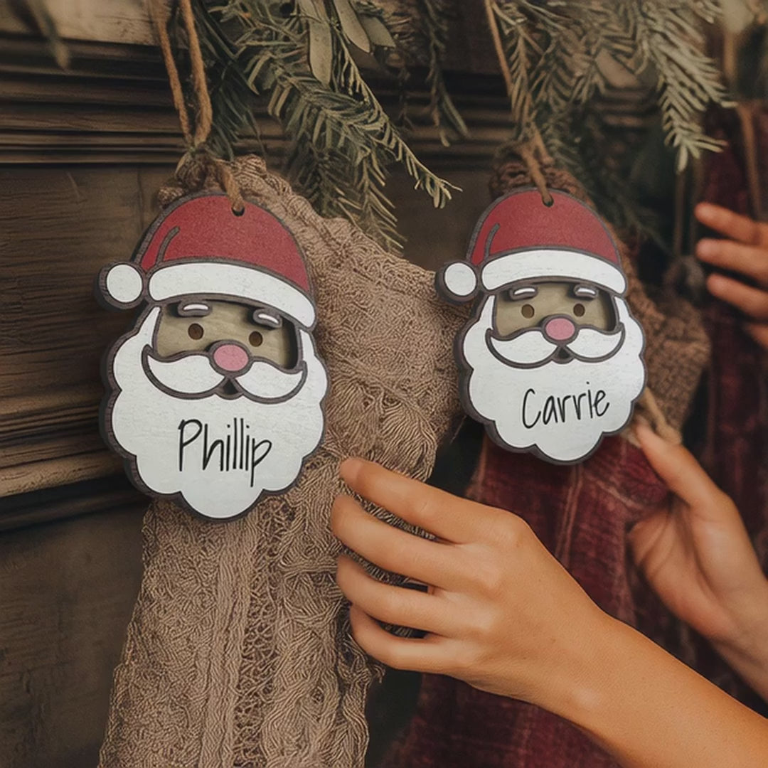 "Personalized Santa stocking tag with custom name, festive Christmas decor ornament hanging on a stocking."